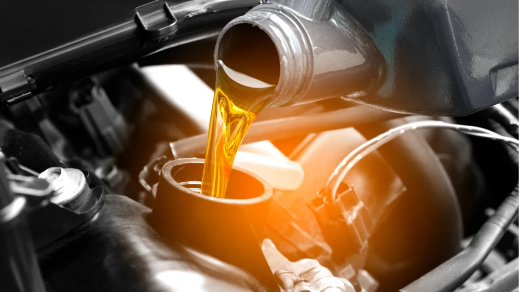 Refueling and pouring oil quality into the engine motor car Transmission and Maintenance Gear .Energy fuel concept.