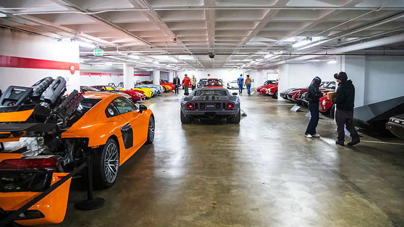 2024-11-15 Los Angeles USA A vast underground car collection at Petersen Automotive Museum's Vault, featuring rare classic, exotic, and concept cars in a dimly lit garage.